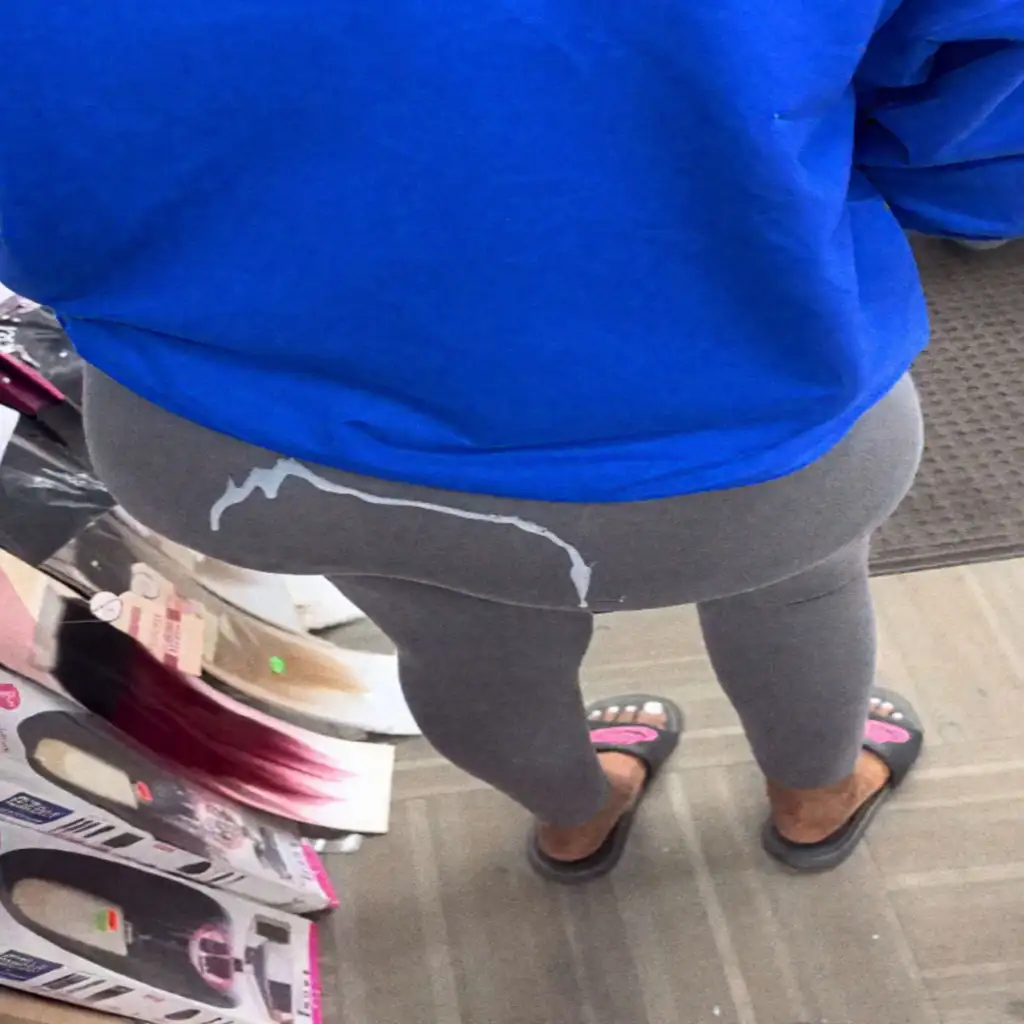 Cream on the ass of the hot brunette in the store